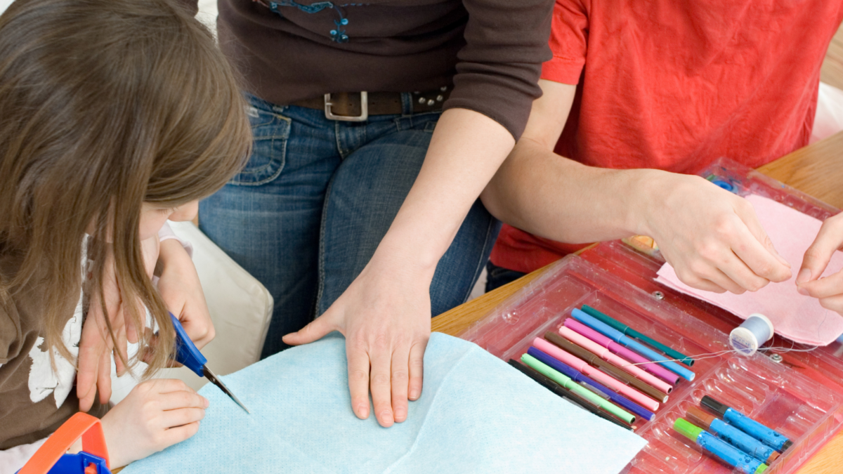 Adults and children being creative art and crafts